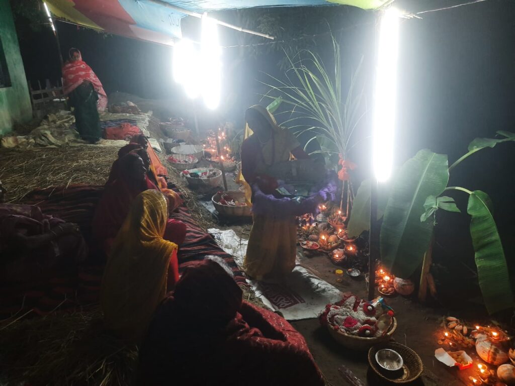 Chhath devotees staying awake throughout the night at the Chhath Ghat