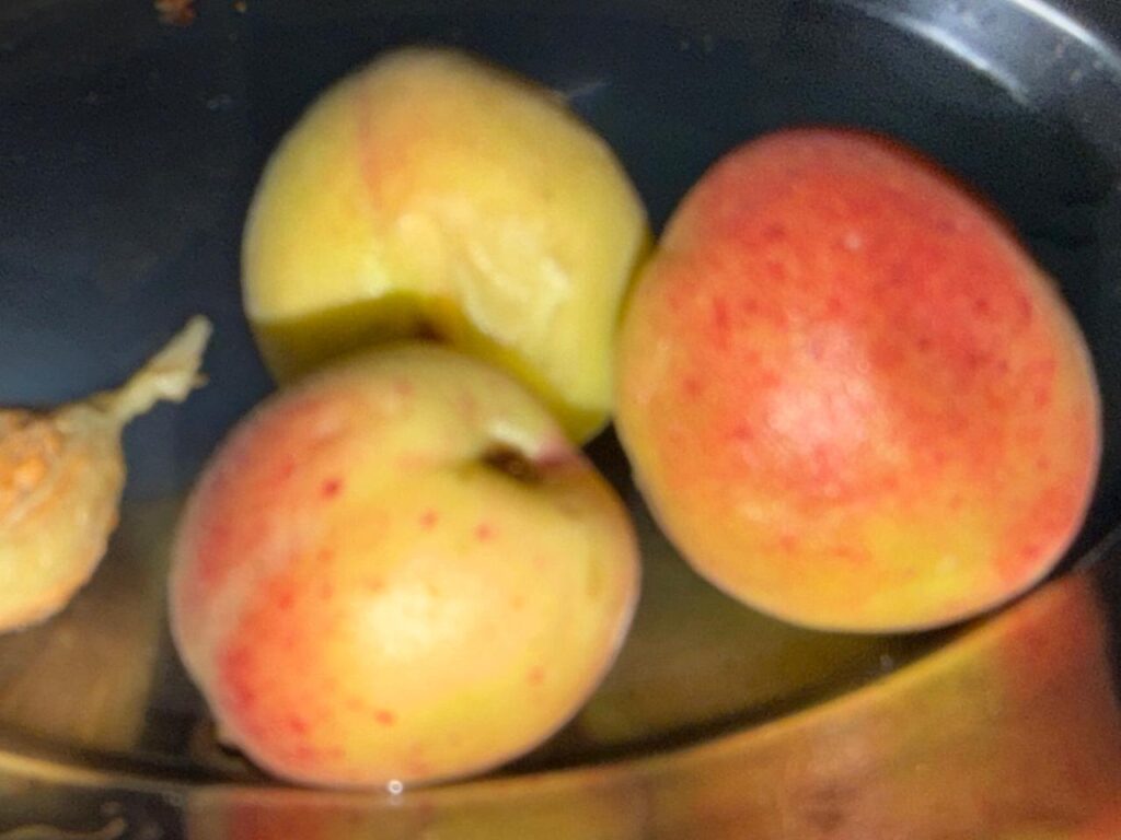 Fresh and juicy sun-ripened peaches, ready to be enjoyed