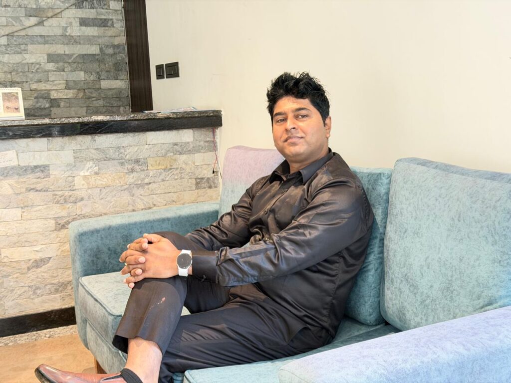 Mr. Universe poses in the reception of the Mid Hill Agro Farm Resort