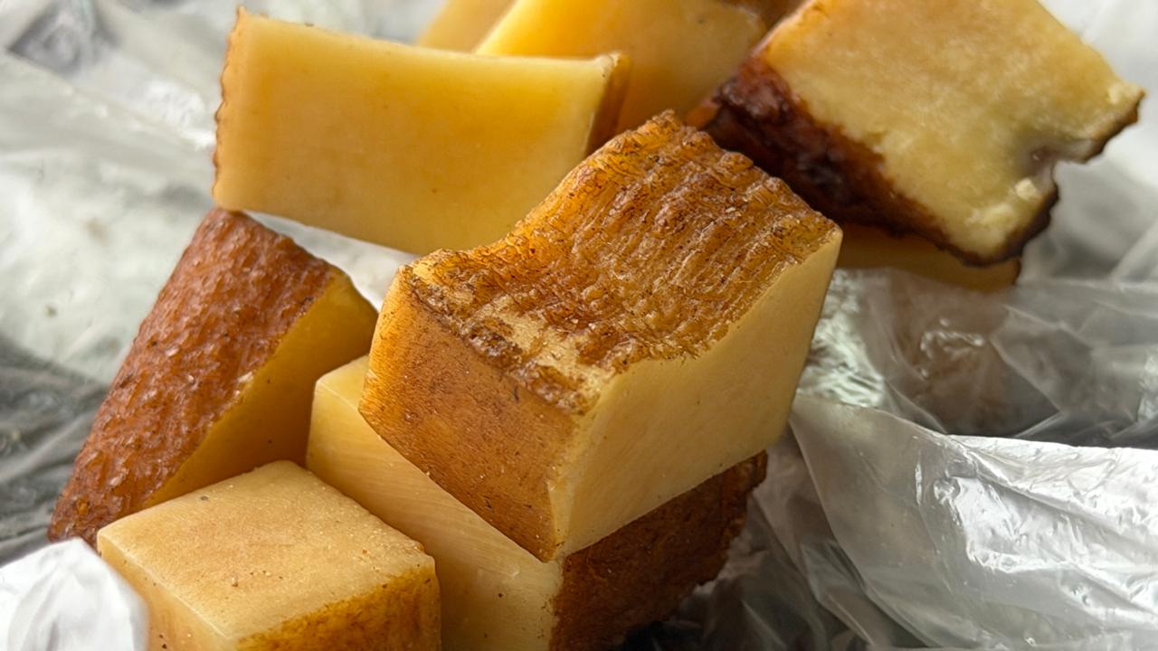 Smoked Himalayan hard yak cheese (Chhurpi) cut into small cubes, traditional Nepalese snack.